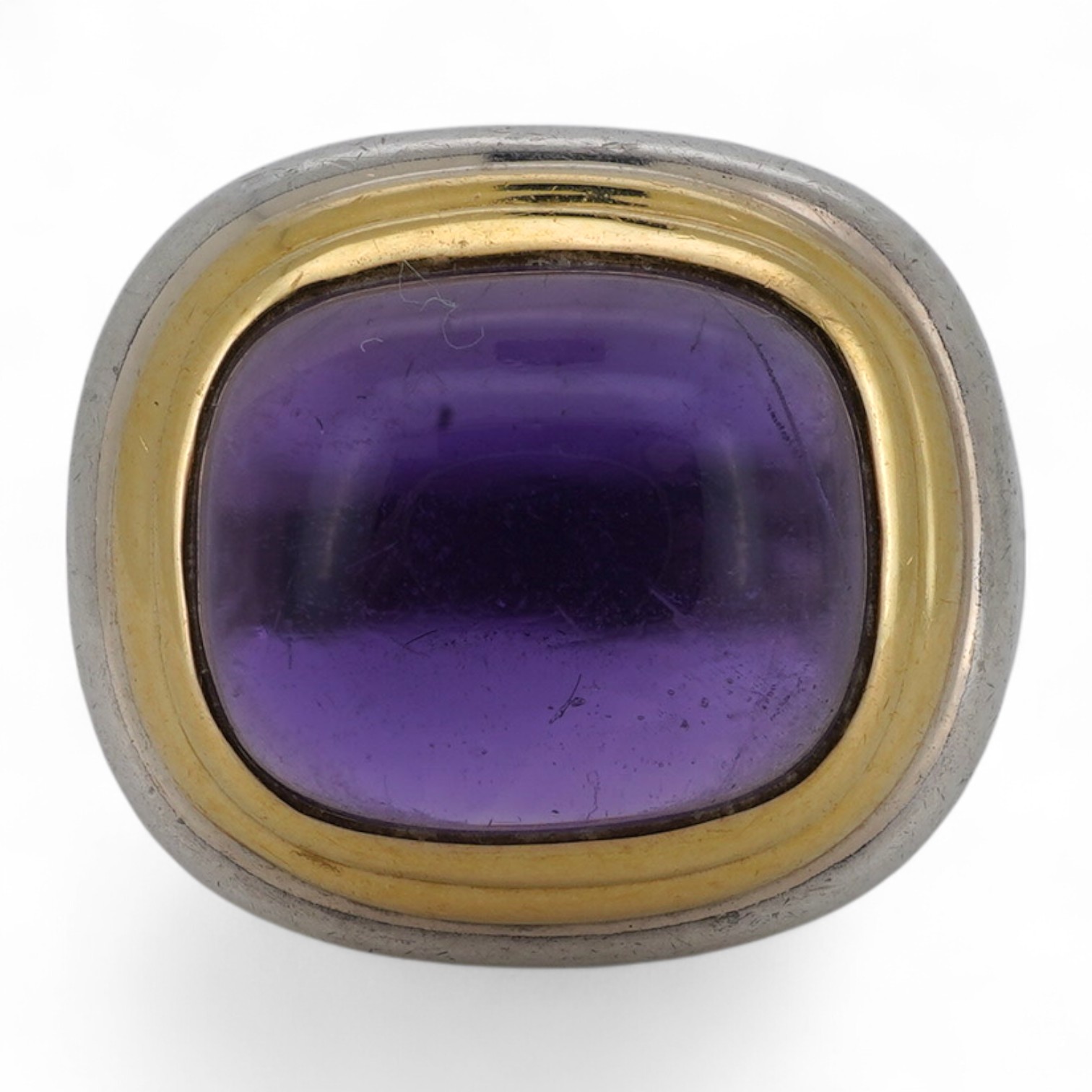 Paloma Picasso for Tiffany & Co., an amethyst ring, set with a sugarloaf cabochon amethyst, collet-set in bicoloured silver, size L, signed Tiffany & Co. and Paloma Picasso, British hallmarks for silver, pouch stamped Ti